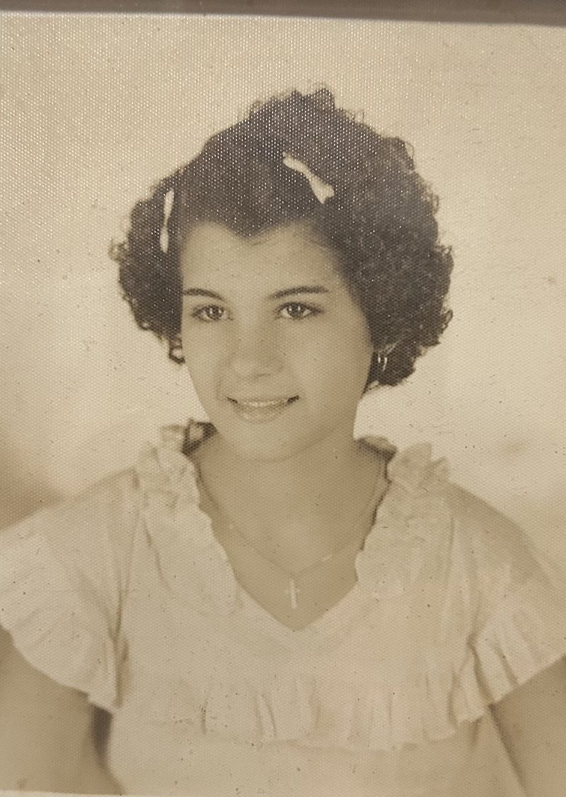 The same portrait before restoration, a faded vintage photo